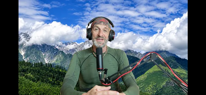 Recording a video with the mountains behind